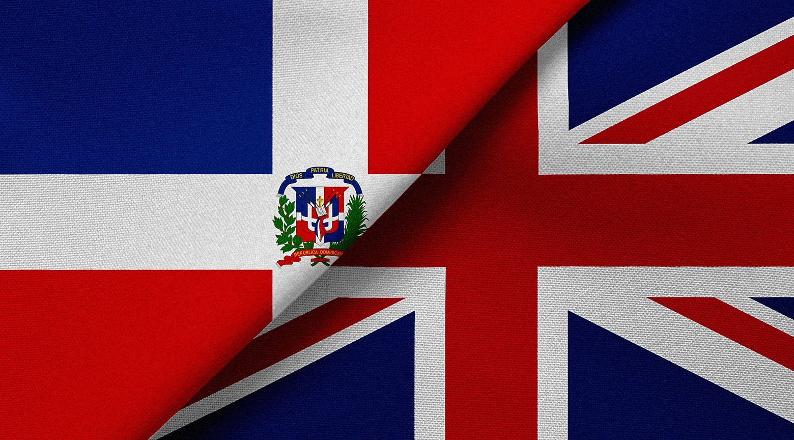 Banderas de República Dominicana y del Reino Unido superpuestas, simbolizando el fortalecimiento de relaciones bilaterales.