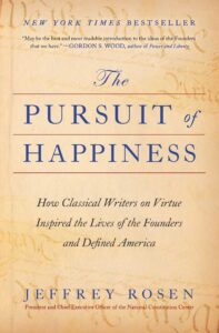 Portada del libro The Pursuit of Happiness, de Jeffrey Rosen, con tipografía clásica en azul sobre fondo beige envejecido y referencias visuales a manuscritos fundacionales.